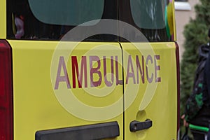 Large ambulance sign on the back door of the car. Ambulance.