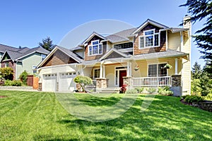 Large American beautiful house with red door.