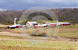 A large Amish farm with corn silos and a big field near Strasburg, Pennsylvania, U.S