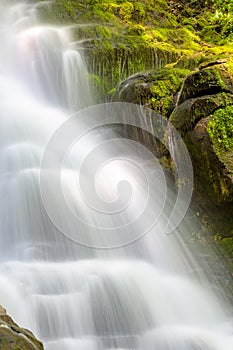 Large amounts of water cascading down Estatoe Falls near Rosman