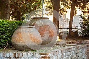 Large antique pots near of the ruins of the Flavian Amphitheater in Pozzuoli.