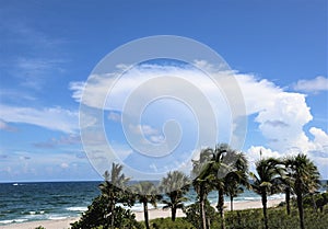 A large anvil cumulus cloud rises south east of the Boca Raton beachfront giving notice that a storm may be on its way