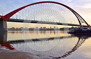 A large arched bridge at dawn