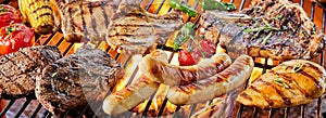 Large assortment of meat grilling on a barbecue photo