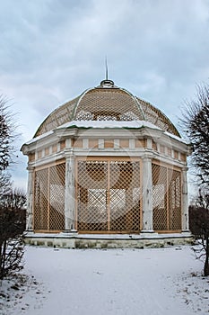 large aviary for birds on the territory of a historical estate in the park