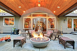 Large back yard with grass.