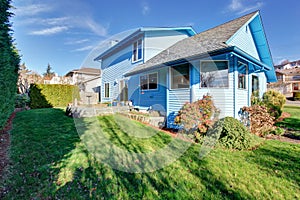 Large back yard with lots of grass.