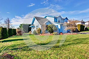 Large back yard with lots of grass.
