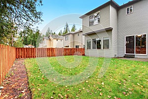 Large backyard with lots of grass.