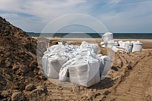 Large bags filled with sand to strengthen the shore