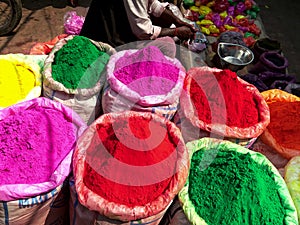 Large bags of powder for holi at the spice market of chandni chowk