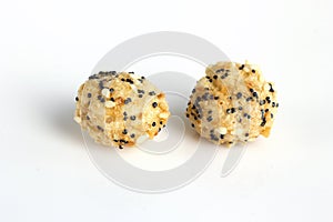 Large baked rice balls with sesame seeds and poppy seeds