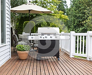 Large barbecue cooker on cedar deck