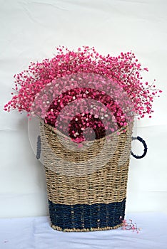 Large baskets woven from hemp rope with full pink flowers