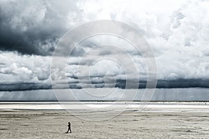 large beach with sormy clouds