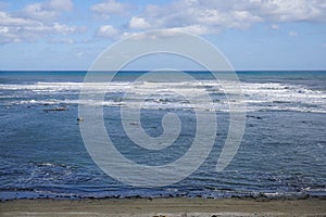 Large beach and stormy sea