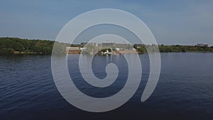 A large beautiful lake and a pier on the shore. Aerial view.