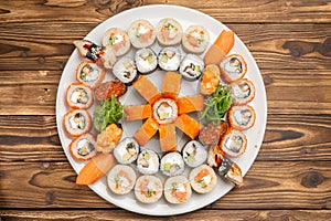 A large beautiful sushi set with maki rolls, nigiri and gunkans