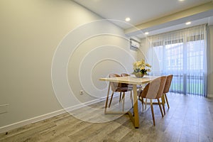 Large beige and cream luxury kitchen interior with empty wall