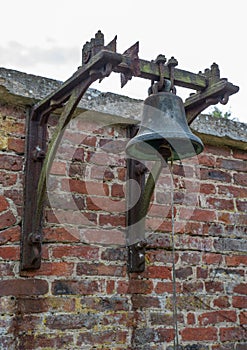 Large bell on a brick wall