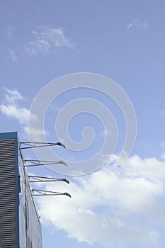 Large billboard And the lamp arm shines Bright sky background