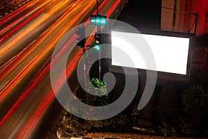 Large billboards on the street at night, with beautiful street lights