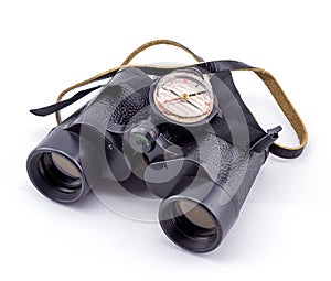 Large binoculars and compass on a white background