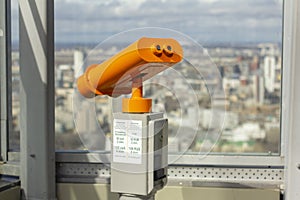 Large binoculars on the observation deck overlooking the city