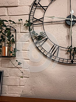 Large black clock with Roman numerals