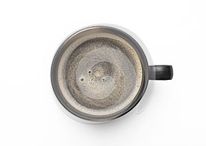 Large black coffee in porcelain cup on white background. Top view