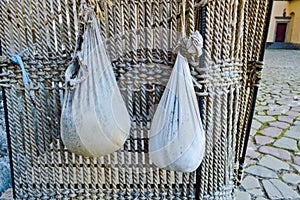 Large black iron old wooden basket of ropes for a balloon with an anchor and sandbags photo