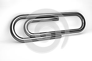 Large black paper clip on white background