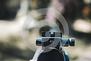 A large black pistol in the hands