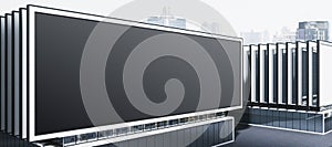 A large, blank billboard installed on the rooftop of a modern building, set against a cityscape background for outdoor advertising