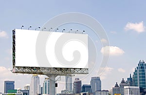 large blank billboard on road with city view background