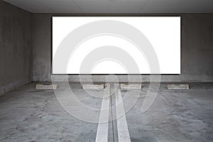 Large blank billboard on the wall of the basement