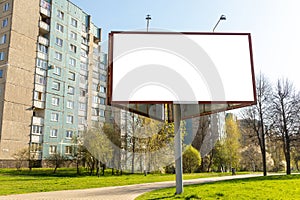 Large blank triangle white billboard in city background