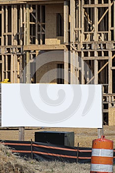 Large Blank White Sign in Front of New Apartment Construction