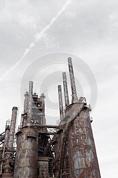 Large blast furnaces and smokestacks from a steel industry complex