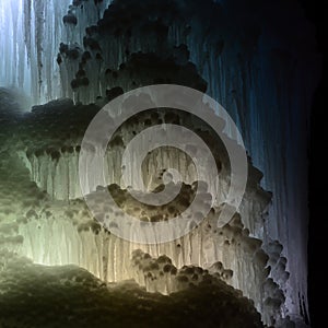 Large blocks of ice frozen waterfall or cavern background