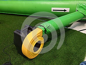 Large blowers of an inflatable system in playground.