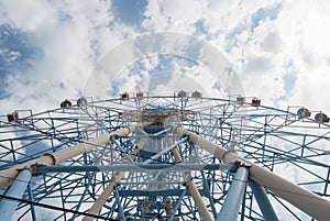 Large blue ferris wheel on a blue sky background