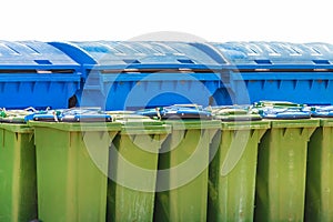 Large blue and small green waste containers