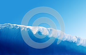 Large Blue Surfing Wave