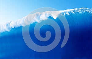 Large Blue Surfing Wave