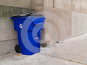 Large Blue Trash Can on a City Sidewalk