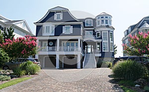 A large blue and white mansion by the bay near Rehoboth Beach, Delaware, U.S