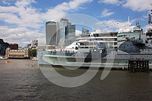 Large boat or ship sails through the English waters of the Thames river