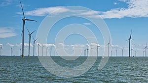 Large body of water with windmills in background