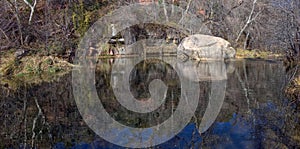 Large boulder in a tranquil part of Oak Creek in Sedona AZ